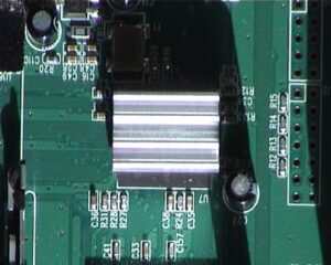 Under the heatsink is the CX82100-4X HNP